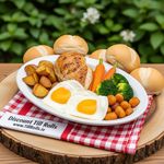 Eco-friendly bagasse oval plate holding a freshly cooked breast of chick with fireed eggs,