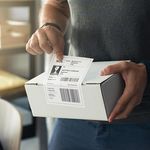 Example shipping label printed on Zebra direct thermal 102 × 152 mm label affixed to parcel