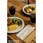 Image of cutlery set at picnic table with food and drinks