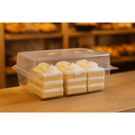 Rectangular clear cake container holding single decorated cake slice