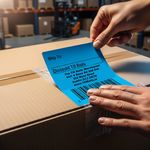 Blue direct thermal shipping label on parcel, ideal for courier use with GLS, DPD, or An Post