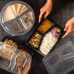 Microwave-safe 24oz container with black base and clear lid, perfect for safe and convenient reheating.