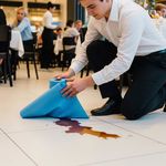 Restaurant staff cleaning upo a spil with Logic8 400 Sheet Blue Roll