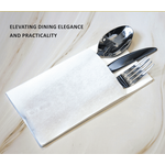 Premium white airlaid pocket napkin with cutlery on marble table — eco-friendly, linen-style napkin for hotels and catering.