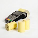 Image of a credit card terminal with yellow credit card rolls in front supplied by Discount Till Rolls