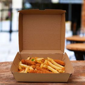 Eco-friendly #12 clam shell menu box securely holding salads and sandwiches, ensuring safe delivery and reducing environmental impact.