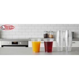 Lightweight clear plastic cups ready for serving cold drinks at an outdoor celebration.