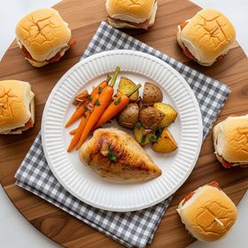 Bulk pack of 6-inch White Greenspirit Paper Plates with food, biodegradable and perfect for catering and events