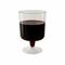 Disposable 200ml wine glass filled with wine, ideal for outdoor bars, catering services, and tastings.